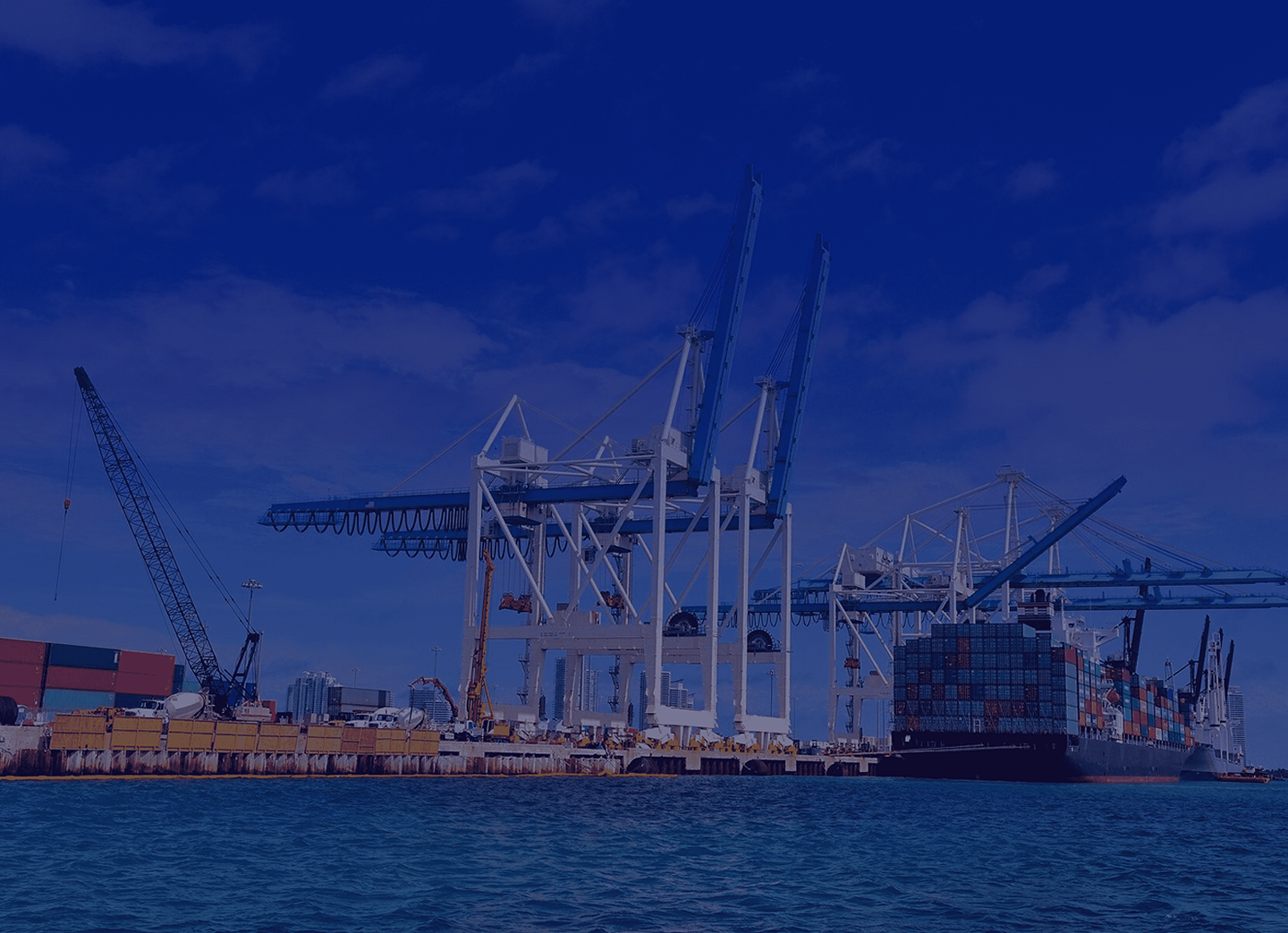 Background image of a port with cranes and containers